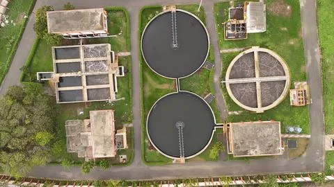 Top Down Drone View of Wastewater Treatment Facility with Circular Clarifiers Stock Photos