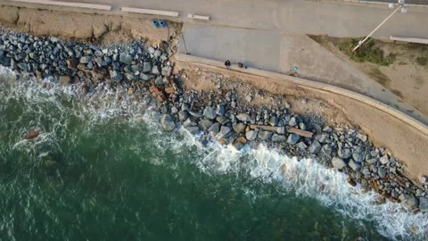 Top Down Drone View of Waves Breaking on Coastal Rocks Video stock 330363680