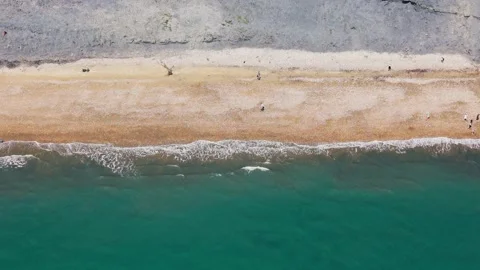 Top Down Drone View of Waves and Beach at West Bay Dorset England Stock Footage 341433095