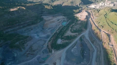 Top down drone yaw revealing vast open pit mining complex near Brasília Brazil Stock Footage 335462310