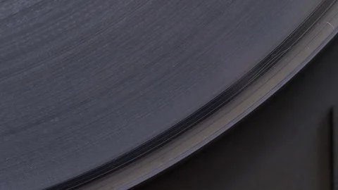 Top down extreme close up of needle drop on spinning vinyl record Stock Footage 88793800