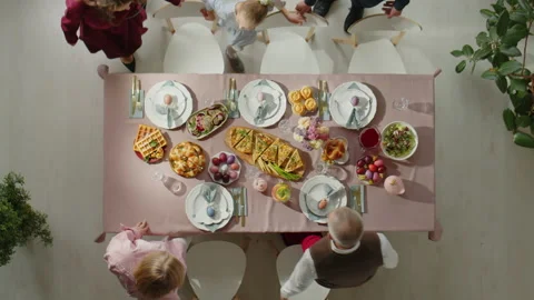 Top Down of Family Gathering for Easter Dinner Stock Footage 224552332
