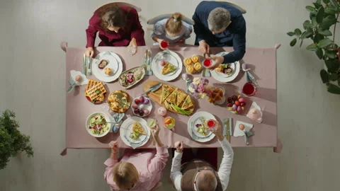 Top Down of Family Toasting on Easter Dinner Stock Footage 224551673