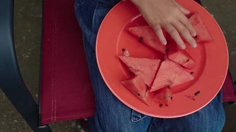 Top Down Flat Lay Shot of Fresh Sliced Watermelon Slices on Red Plate Summer Stock Footage 345309759
