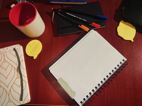 A top-down flat lay view of a wooden desk setup prepared for studying, planning, Stock Photos