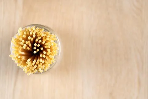 Top down flat lay view of raw spaghetti pasta in a glass container Stock Photos