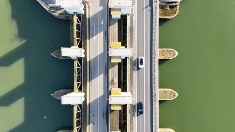 Top down flight above lock complex and roadway Stock Footage 331838887