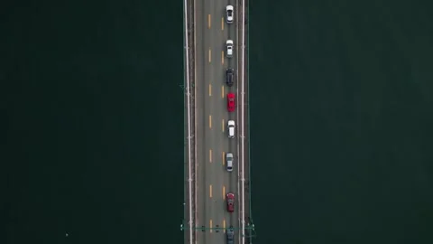 Top down flight across Lions Gate bridge with passing boats 動画素材 248479738