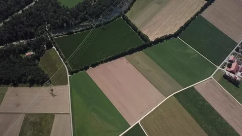 Top down flight from fields toward Lyss industrial zone Stock Footage 331897383