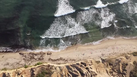 Top-Down flight over the coast of sunset cliffs California Stock Footage 312718501