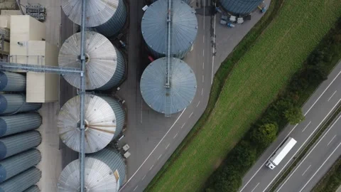 Top-Down Flight Over Grain Storage Silos Beside a Motorway – Bavaria Video stock 343891586