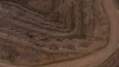 Top down fly over quarry iron mining aerial video filming drone. Industrial Stock Footage 251042860