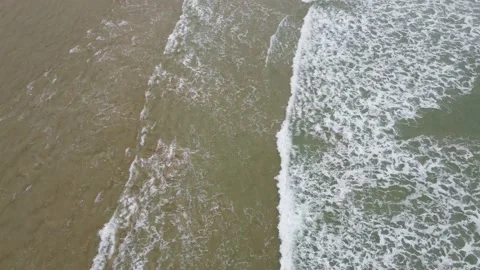 Top down fly over on-shore waves in playa de Gerra, Cantabria, Spain 4K Stock Footage 155593310