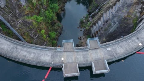 Top-Down Flyover of Lake Kokanee Dam and Downstream Gorge Stock Footage 345888309
