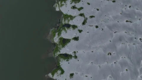 Top down flyover reveals drought-exposed Po River sandbanks and Isola Serafini Stock Footage 340604011