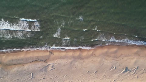 Top down footage over the ocean waves coming on the Inverness sandy beach in 스톡 동영상 254809262