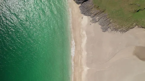 Top down, forward moving aerial view of Mingulay Bay, Outer Hebrides, Scotland Stock Footage 233102370