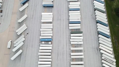 Top down forwarding shot of Semi Truck, while a truck passing the parked Stock Footage 234860139