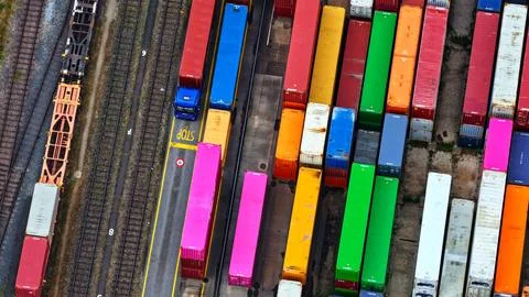 Top-Down Freight Terminal with Containers, Trucks and Railway Tracks Stock Photos