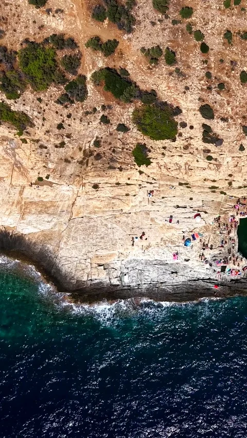 Top down Giola natural pool on the rocky coast, Thassos, vertical Stock Footage 347178528