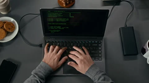 Top Down of Hands of Male Software Engineer Coding on Laptop at Grey Office Desk Stock Footage 329609951