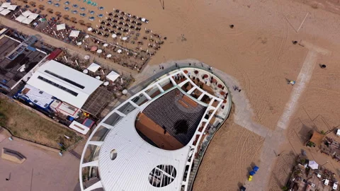 Top-down high-angle aerial drone view of a unique futuristic oval-shaped Stock Footage 337972168