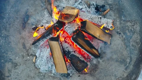Top down high angle close up of outdoor fire pit, flames and burning wood Stock Footage 228903175