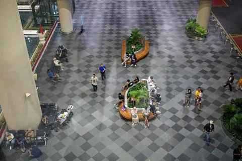 Top-down high angle view showing passengers sitting and walking in the terminal Fotos de archivo