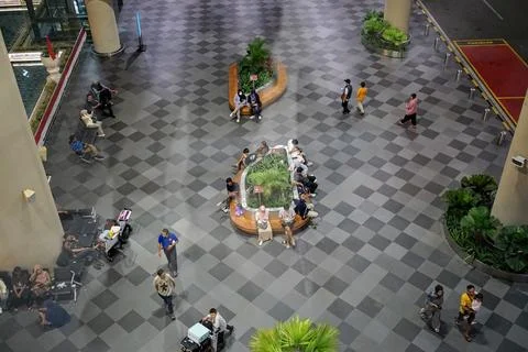Top-down high angle view showing passengers sitting and walking in the terminal Fotos de archivo