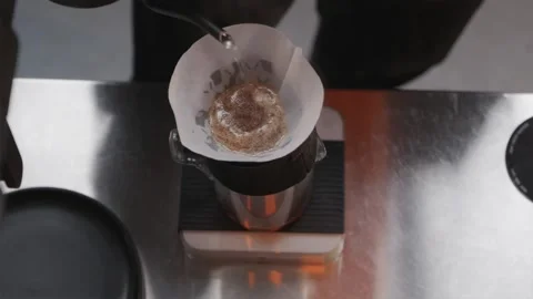 Top down horizontal view of barista brewing pour over coffee Stock Footage 334732458