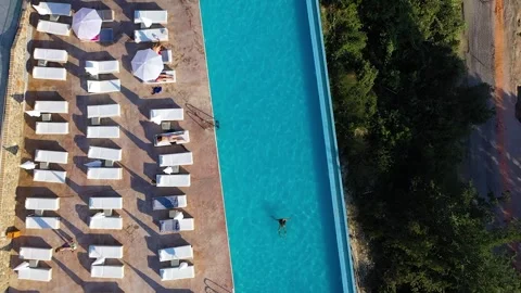 Top down hotel pool. The surroundings, a... | Stock Video | Pond5