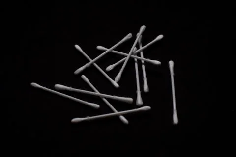 Top down image of ear buds scattered in a dark copy space background. Object  Stock Photos