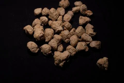 Top down image of a heap of soya chunks in a dark copy space background. Food Stock Photos