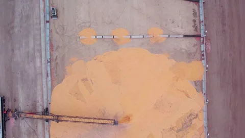 Top down Industrial grain storage site with a conveyor belt unloading from Stock Footage 255633950