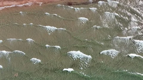 Top Down of Lake Superior Waves Calmly Crashing Onto Sandy Beach Stock Footage 315265050