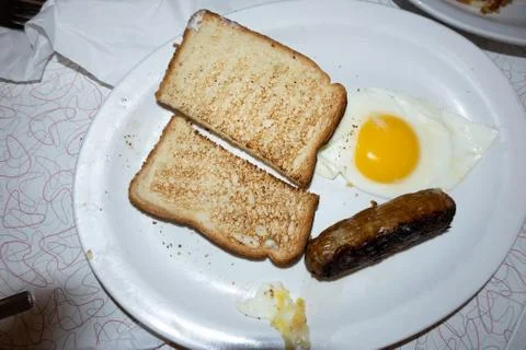 Top down look at breakfast with egg toast and sausage Stock Photos