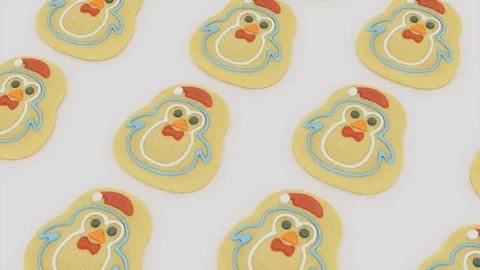Top down loopable pan across santa themed gingerbread man biscuits - 4k loop Stock Footage 120386820