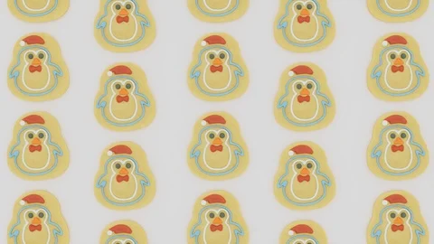Top down loopable pan across santa themed gingerbread man biscuits - 4k loop Stock Footage 120386840
