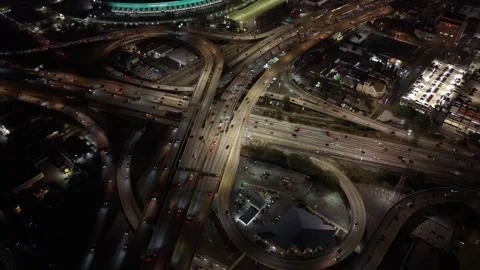 Top-Down Los Angeles Freeway Interchange Filled with Night Traffic Stock Footage 345703145