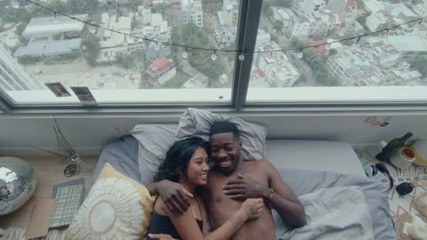 Top Down of Loving Couple Chatting on Bed after Wake Up Video stock 236684540
