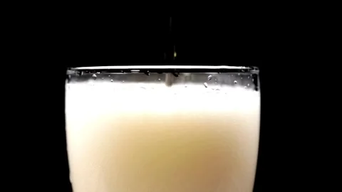 Top-down macro super slow motion studio shot with copy space. pouring a beer Stock Footage 265836773
