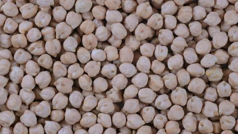 Top-down macro video of dried uncooked chickpeas seeds Stock Footage 285907381