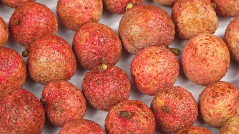 Top Down Macro View of Fresh Ripe Lychees Wet with Water Stock Footage 337326856