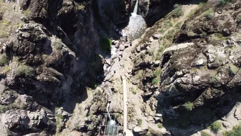 Top down of mountain waterfall oasis with hiking tourists in Kazakhstan Stock Footage 337661831