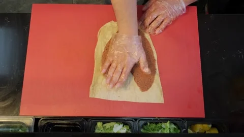 Top Down Ninety Degree View Chef Spreading Cig Kofte on Lavash Stock Footage 336214485