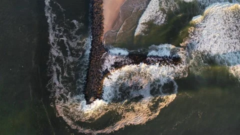 Top down of an Ocean Jetty with Waves Crashing Stock Footage 241028518