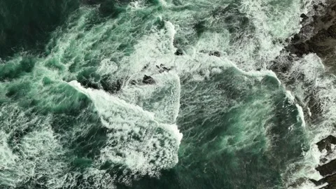 Top down ocean waves via drone crashing blue water against the shore Stock Footage 282733654