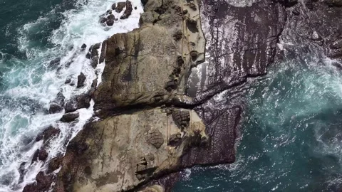 Top Down Orbit Drone Shot of Ocean Waves at Chaojing Park Keelung Taiwan Stock Footage 343940658
