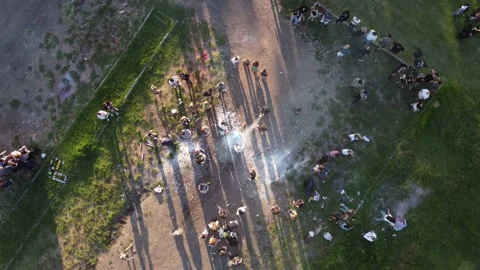 A top-down orbital shot above a traditional graduation celebration in Stock Footage 239060913