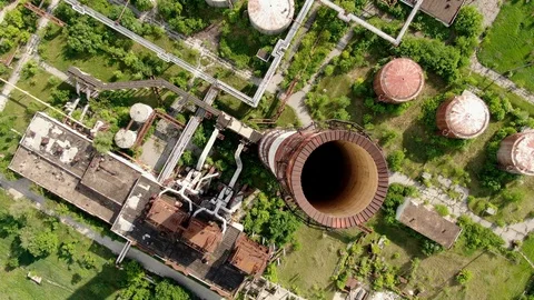 Top down over a chimney stack of an abandoned power station in Eastern Video stock 112255290